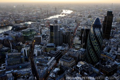 Lights come on as the sun begins to set