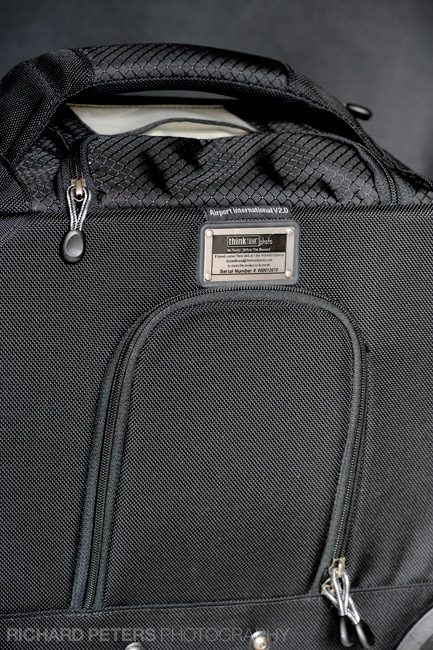 Rear lock concealed behind a zipped flap on the Airport International v2.0 bag
