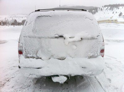 Thick ice builds up in the extreme cold and our car feels the full brunt of a cold day in Yellowstone durnig winter.