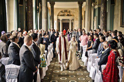The Nikah, walking down the isle together Nikah ceremony at the Sculpture Gallery, Woburn Abbey. Guy Collier wedding photography