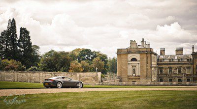 An Aston Martin, parked outside Woburn Abbey. Guy Collier wedding photography