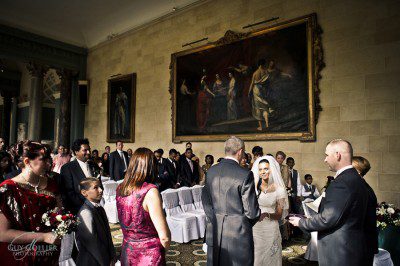 Exchanging vows in the stunning Sculpture Gallery Exchanging vows in the stunning Sculpture Gallery at Woburn Abbey. Guy Collier wedding photography